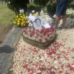 Grave of Pablo Escobar at Montesacro Cemetery in Medellin during a historical tour